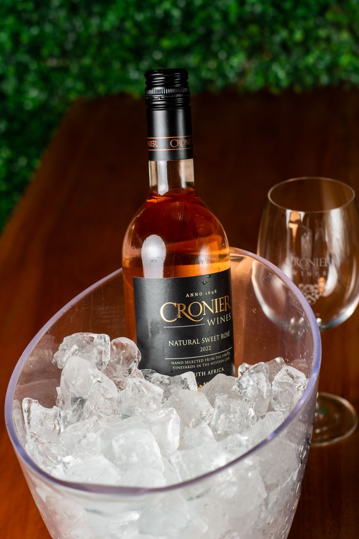 Cronier Wines Natural Sweet Rosé bottle chilled in ice bucket, perfect for a refreshing drink.